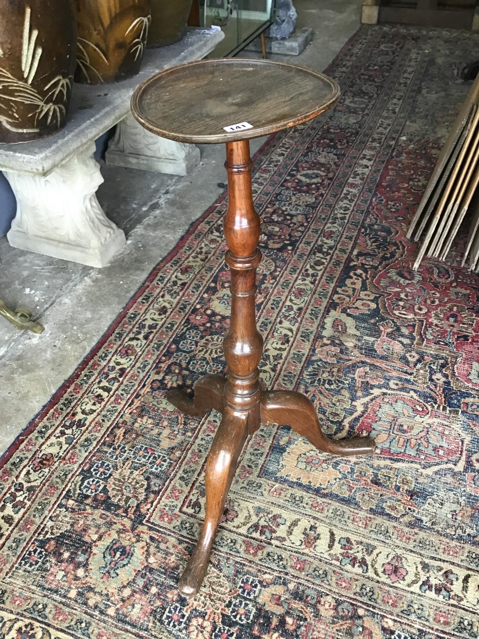 A Victorian walnut piano front pop up davenport width 58cm, depth 54cm, height 92cm, and a George III style oak tripod candle stand height 83cm